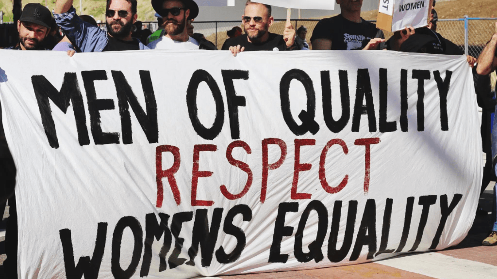 "Men of Quality Respect Womens Equality" Banner auf Demo
